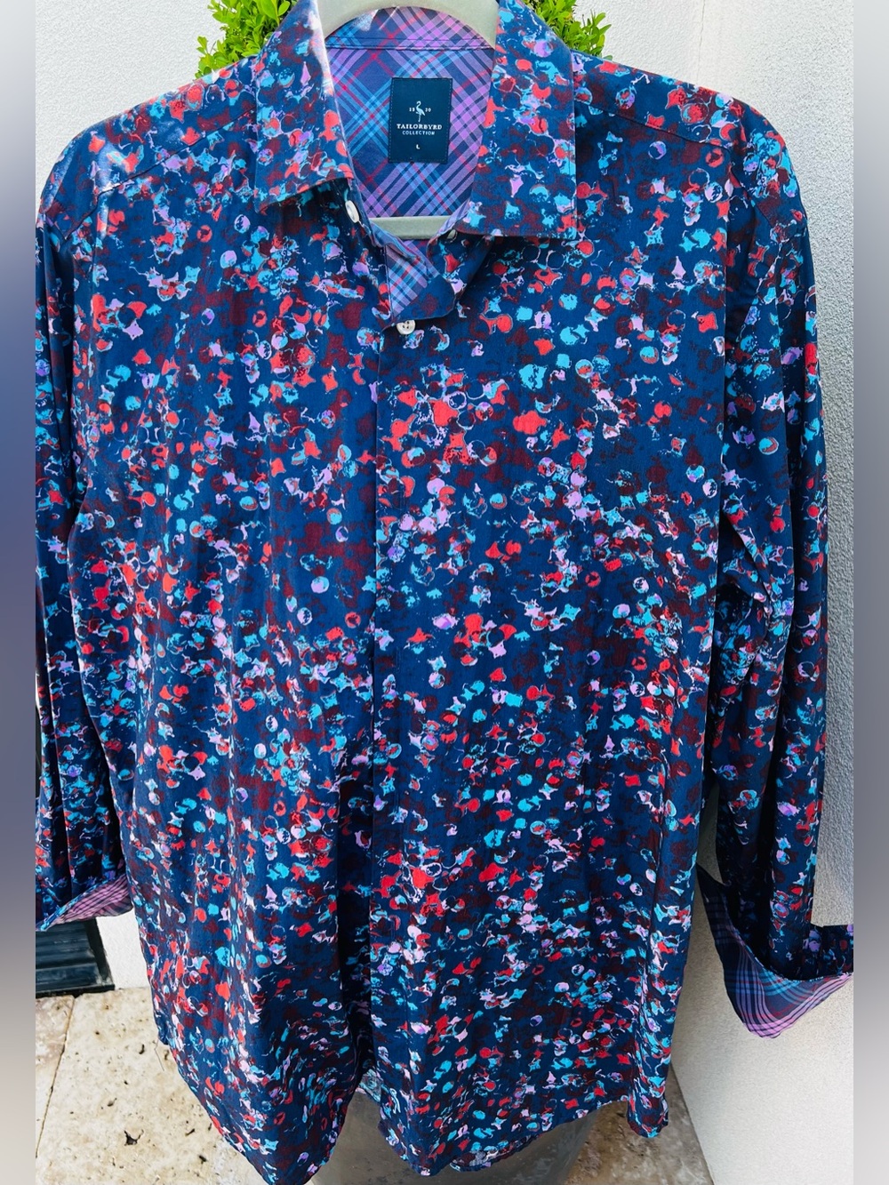 Tailorbyrd Collection button-down shirt features a vibrant blue, red, and pink.